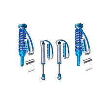 Load image into Gallery viewer, A set of blue King Shocks, featuring advanced valving technology, providing superior off-road performance, displayed on a white background.