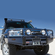 Load image into Gallery viewer, An Old Man Emu 2 inch Lift Kit for LandCruiser 100 Series, Lexus LX470 (98-07) is parked in the desert, showcasing its impressive ground clearance and reliable suspension system.