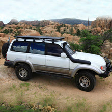Load image into Gallery viewer, Enhance your Toyota Land Cruiser with a superior Old Man Emu OME 2 inch Lift Kit for LandCruiser 80 &amp; 105 Series (90-07) suspension system and increase its ground clearance. This roof rack is designed to seamlessly integrate with your vehicle, providing ample space for all.