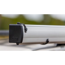 Load image into Gallery viewer, A car with an ARB Touring Awning with Light 814410 and retractable awnings attached to it.