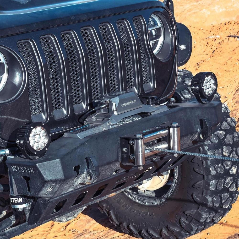Superwinch SX10 Winch 1710200 mounted on a Jeep Wrangler front bumper with heavy-duty clevis hook and winch cable