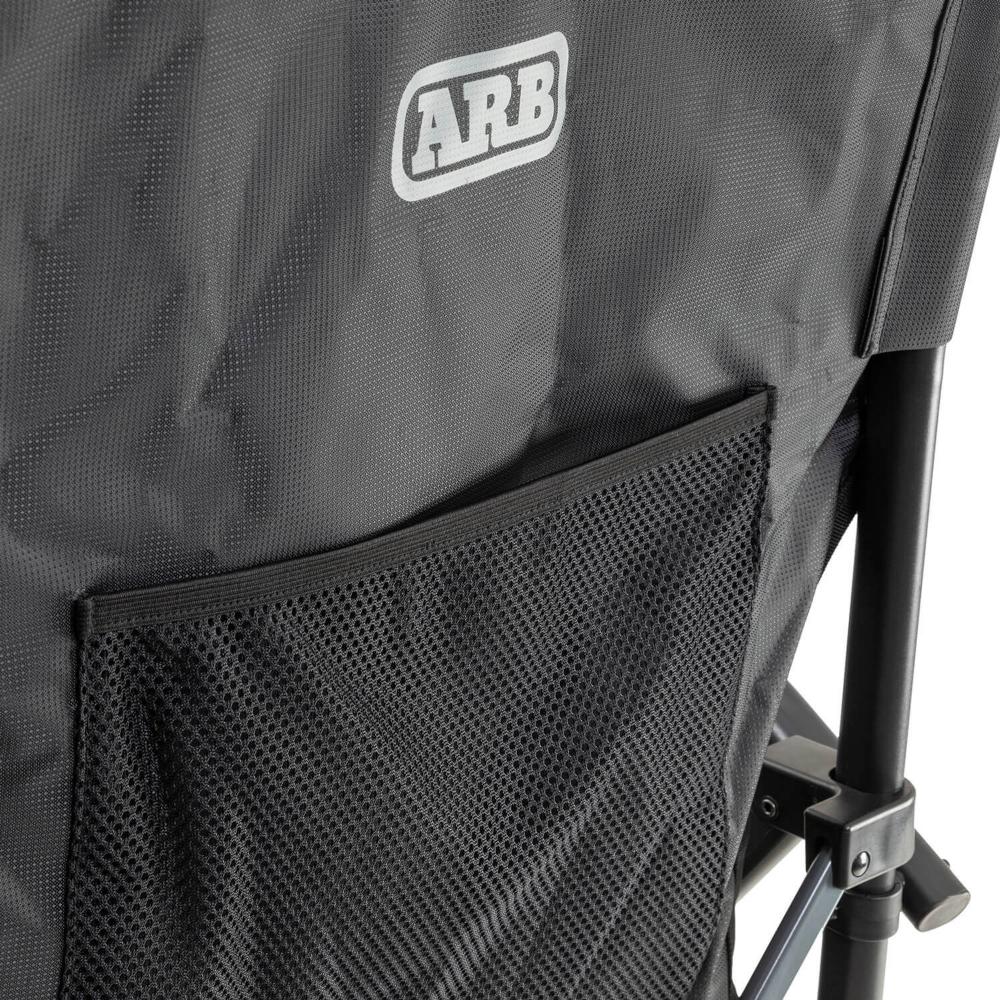 ARB Base Camp Chair 10500151 with heavy-duty steel frame, mesh rear storage pocket, and durable black fabric panel