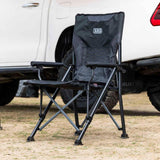ARB Base Camp Chair 10500151 with heavy-duty steel frame, padded armrests, swivel cup holder, and rear mesh storage pocket