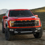 Baja Designs 21-22 Ford F-150 Raptor S2 SAE Dual Fog Pocket Light Kit - Clear high-performance LED fog lights mounted on red truck