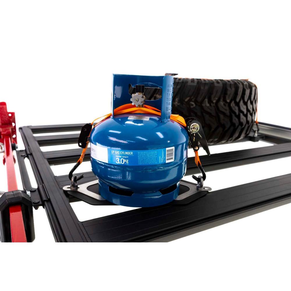 ARB Base Roof Rack Gas Bottle Holder 1780250 with adjustable stainless steel locking brackets and ratchet strap tie-downs securing gas bottle