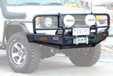 ARB 3412130 Deluxe Bar Toyota Pre 2007 LC70 Series heavy-duty steel front bumper with integrated winch mount and light guards