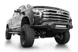 Addictive Desert Designs Black Label Front Bumper on lifted 2022-2024 Chevrolet Silverado 1500 with off-road tires and LED lighting