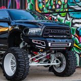 Rigid Industries Radiance+ 20in. RGBW Light Bar mounted on lifted black 4x4 truck with aggressive off-road tires and white wheels