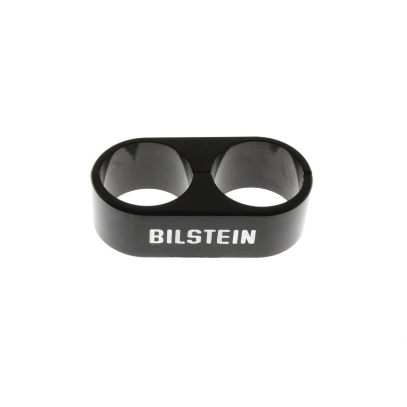 Bilstein B1 Reservoir Clamps - Black Anodized dual-tube clamp for secure mounting of suspension reservoirs on off-road vehicles.