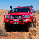 ARB Front Non-Winch Bumper 3214510B - Fitting Kit Included on 2009 Toyota Hilux with heavy-duty steel construction and off-road accessories