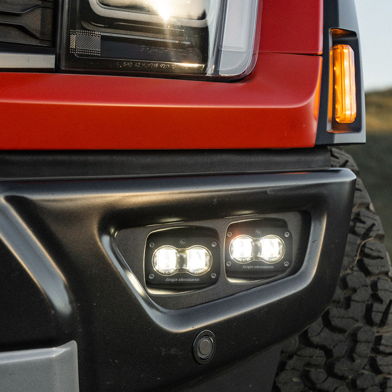 Baja Designs 21-22 Ford F-150 Raptor S2 SAE Dual Fog Pocket Light Kit - Clear high-intensity LED fog lights mounted in black bumper pocket