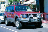 ARB Front Combination Bumper 3434050B for Mitsubishi Montero (2000-2003) with heavy-duty steel and fitting kit included