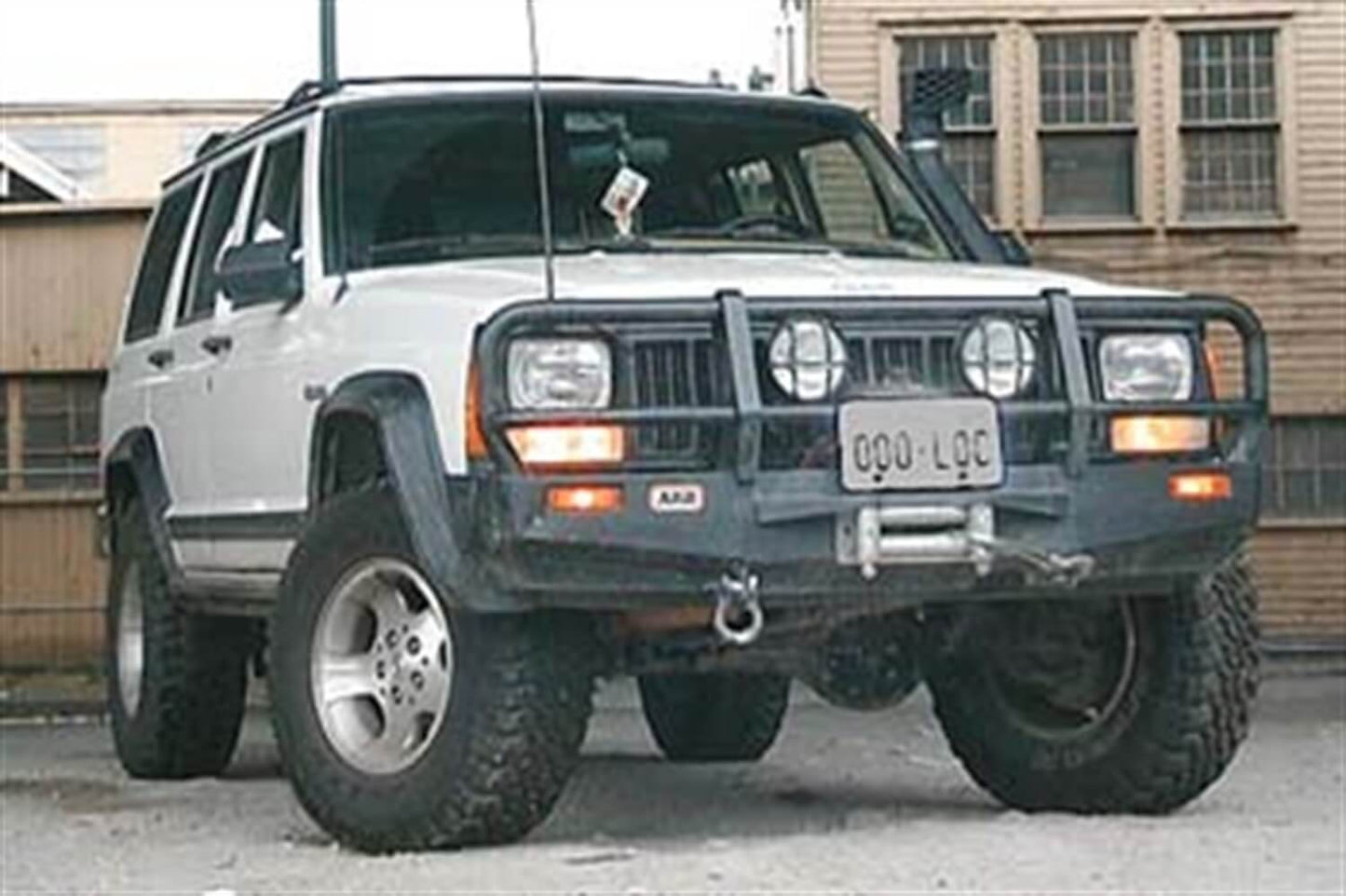 ARB Front Winch Bumper 3450010B for Jeep Cherokee (1984-1996) with heavy-duty steel, black powder coat, fitting kit included