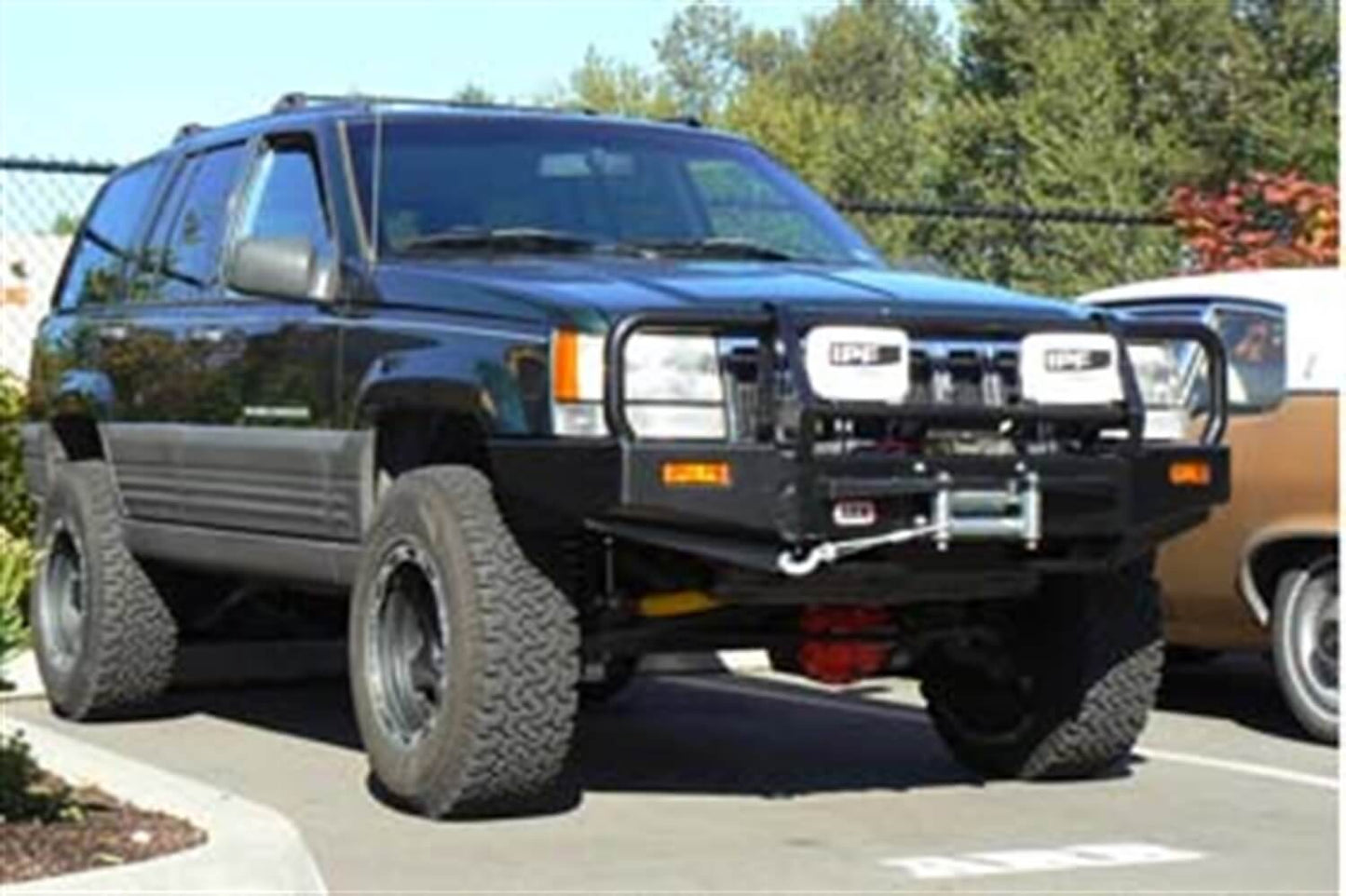 ARB Front Winch Bumper 3450060B for Jeep Grand Cherokee (1993-1998) with heavy-duty steel, black powder coat finish, fitting kit included