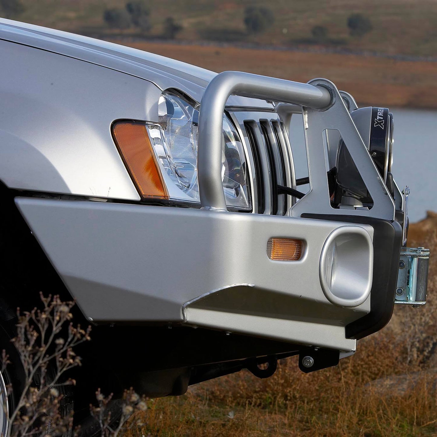 ARB Front Combination Bumper 3450130B for Jeep Grand Cherokee (1999-2007) with heavy-duty steel and fitting kit included
