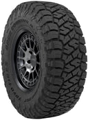 Toyo Open Country R/T - 265/70R17 tire with aggressive tread pattern on KMC wheel for off-road 4x4 performance