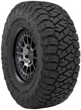 Toyo Open Country R/T - 265/70R17 tire with aggressive tread pattern on KMC wheel for off-road 4x4 performance