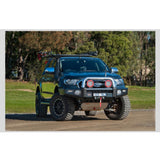 ARB Sahara Deluxe Front Bumper 3940420B - Fitting Kit Included on 2015 Toyota Hilux with black powder-coated steel and upswept wing design