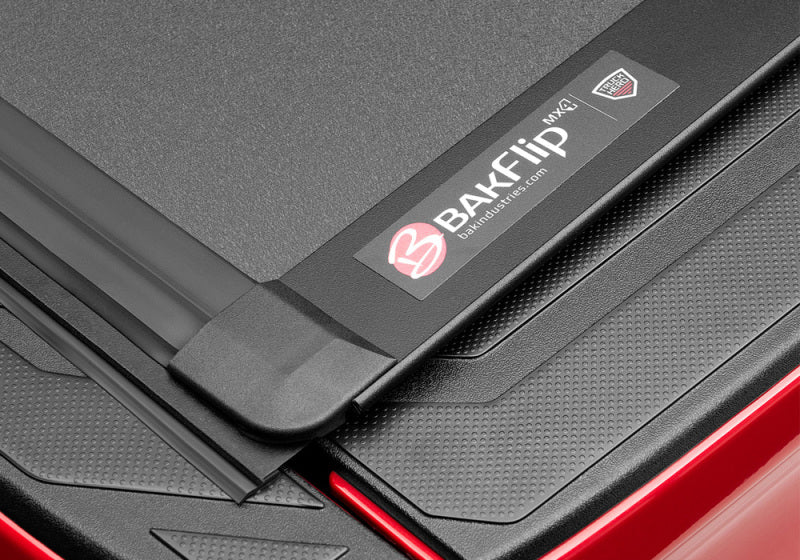 BAK BAKFlip MX4 Hard Folding Tonneau Cover 448446 for Toyota Tacoma (24-ON) with textured matte panels and secure hinges