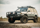 Dobinsons Side Steps With Side Rails - SR59-164 installed on lifted Toyota Land Cruiser 100 Series off-road 4x4 vehicle