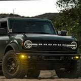 Baja Designs 21-22 Ford Bronco w/Steel Bumper S2 SAE Sportsmen Fog Pkt Light Kit w/Upfitter - Amber high-intensity LED fog lights on off-road steel bumper