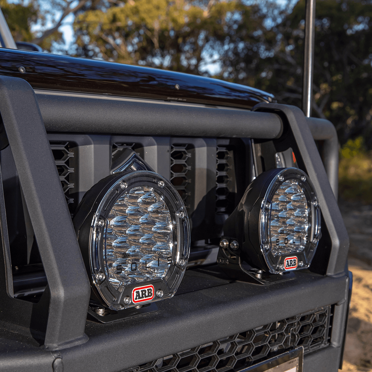 ARB Intensity Solis 21 Spot-Flood Driving Light Kit SJB21SFKIT mounted on off-road vehicle bull bar with diecast aluminum housing and polycarbonate lenses