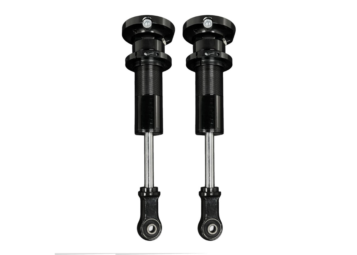 Pair of black adjustable suspension shock absorbers with threaded bodies and eyelet mounts