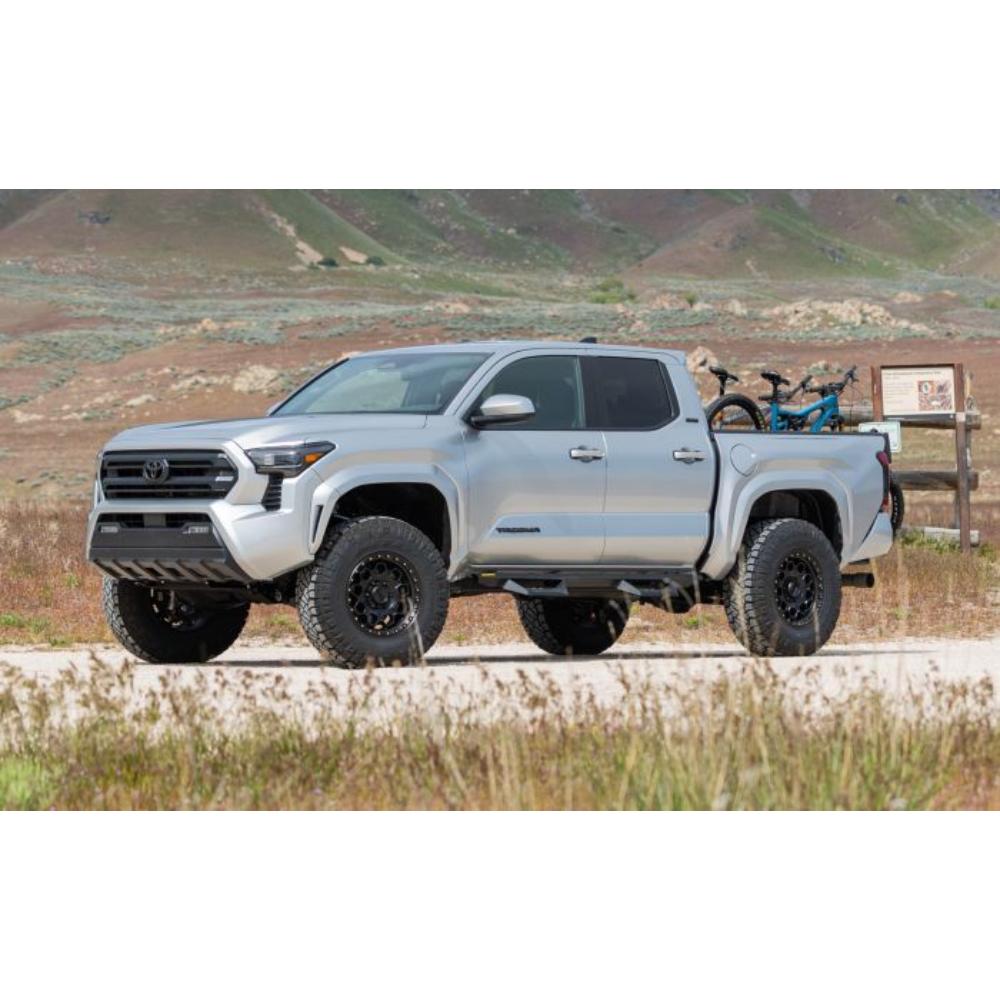 ReadyLift SST 3 inch Lift Kit for Tacoma (24-ON) installed on lifted 2024 Toyota Tacoma with off-road tires and bikes