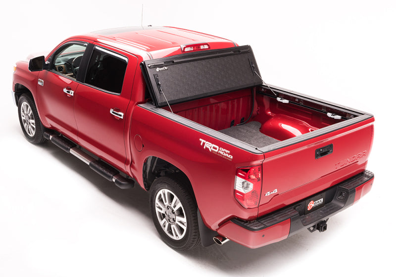 BAK BAKFlip G2 Hard Folding Tonneau Cover 226446 for Toyota Tacoma (24-ON) with textured black panels and durable aluminum frame