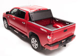 BAK BAKFlip G2 Hard Folding Tonneau Cover 226446 for Toyota Tacoma (24-ON) with textured black panels and durable aluminum frame