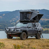 ARB Altitude Hard Shell Electric Rooftop Tent 802500 mounted on Toyota 4Runner with telescoping ladder and off-road setup