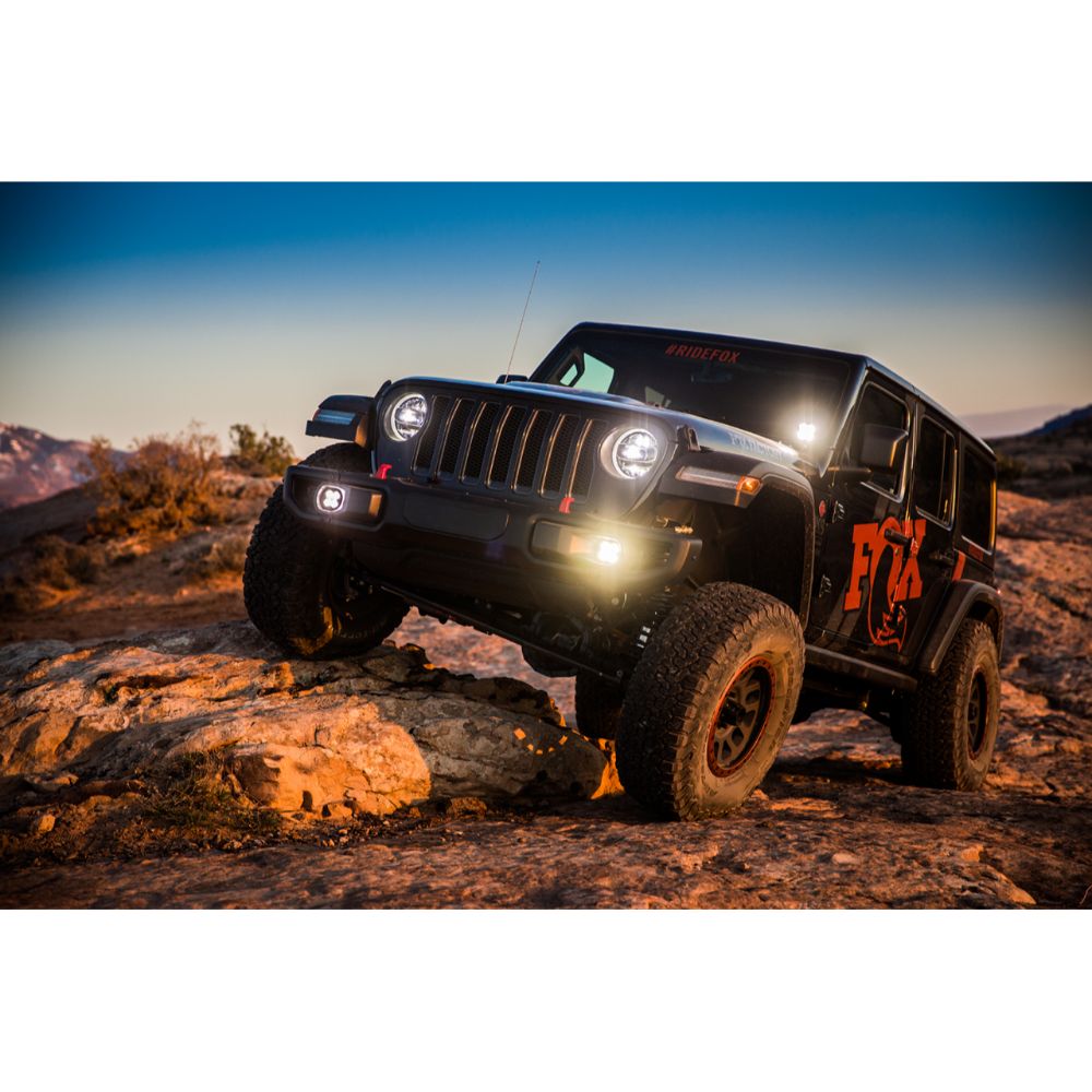 FOX 2.5 Performance Elite Series Rear Reservoir Shock (Pair) - Adjustable 883-26-054 for 2020 Jeep Wrangler JL on rugged off-road terrain