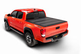 bak BAKFlip MX4 Hard Folding Tonneau Cover 448446 for Toyota Tacoma (24-ON) with textured black panels and reinforced hinges