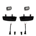 Baja Designs 2019+ Ram 2500/3500 S2 Sport Fog Pocket Kits - White with LED fog lights, black mounting pockets, and wiring harnesses
