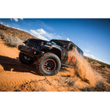 FOX 2.0 Performance Series Smooth Body IFP - Rear Shock 985-24-180 for Jeep Wrangler JL (18-ON) mounted on off-road black JL Wrangler kicking up dirt
