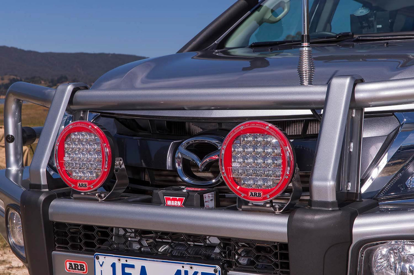 ARB Driving Light Cover AR09 clear polycarbonate lens mounted on front driving lights of 4x4 vehicle