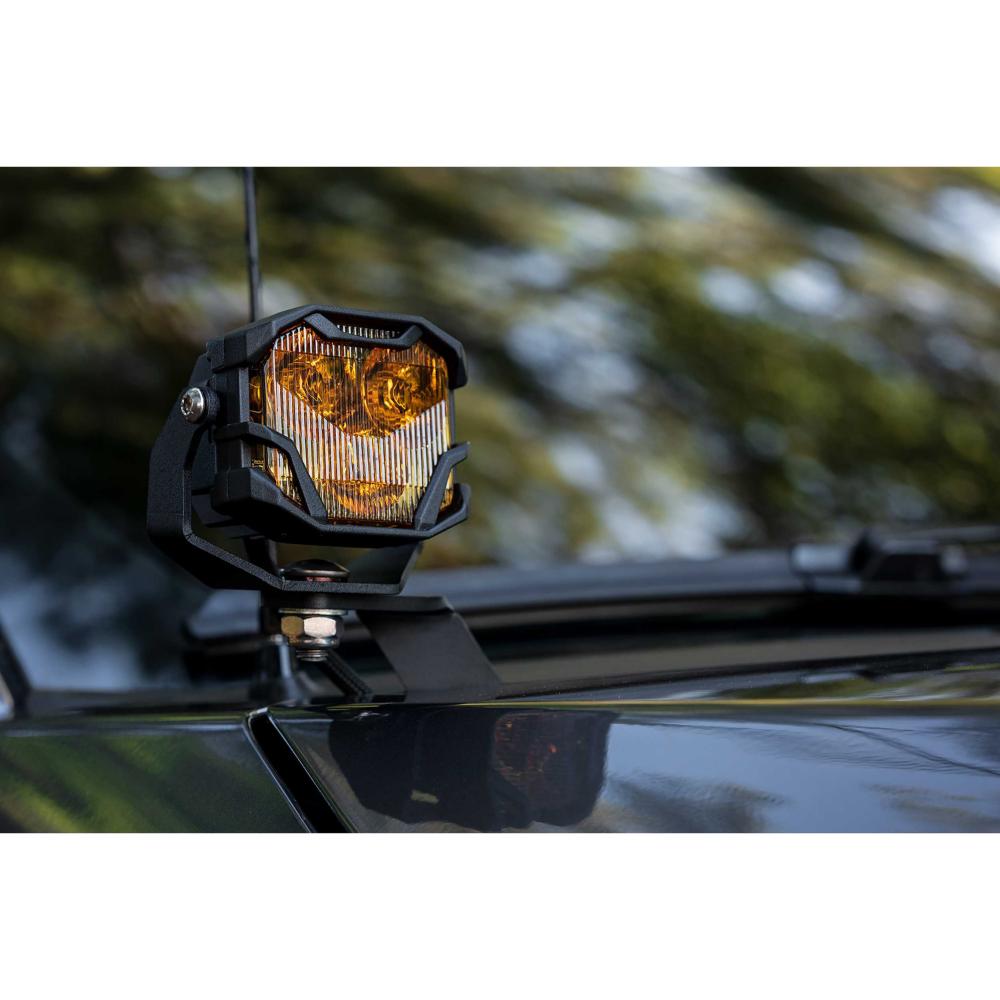 Morimoto 4Banger NCS LED Wide Beam Lights BAF006 amber lens mounted on black roof bracket of off-road vehicle