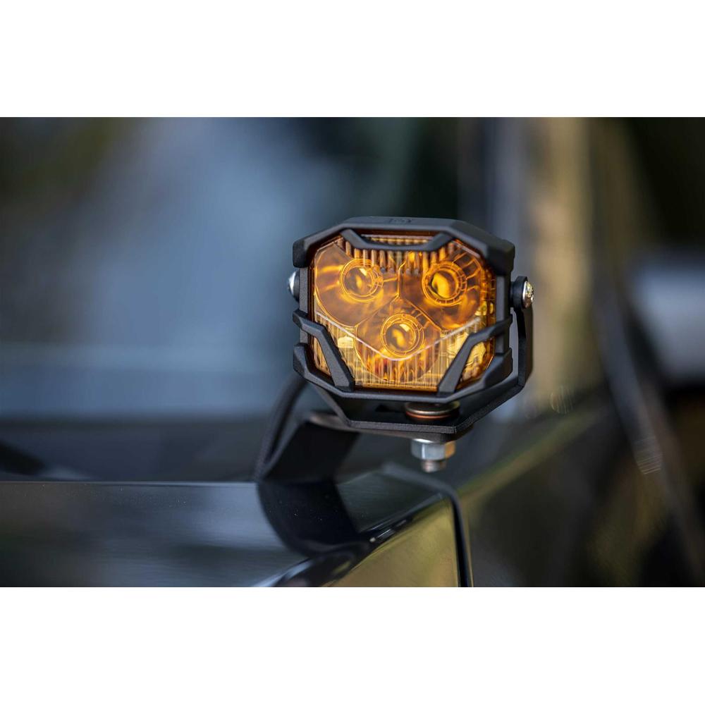 Morimoto 4Banger HXB LED Wide Beam Yellow Lights BAF012 mounted on off-road vehicle hood with adjustable heavy-duty bracket