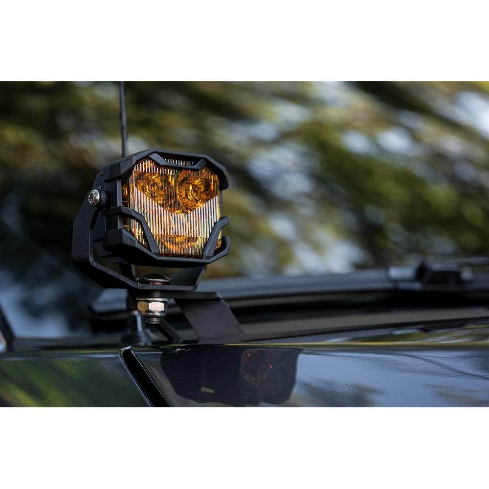Morimoto 4Banger HXB LED Wide Beam Yellow Lights BAF012 mounted with heavy-duty adjustable bracket on off-road vehicle roof