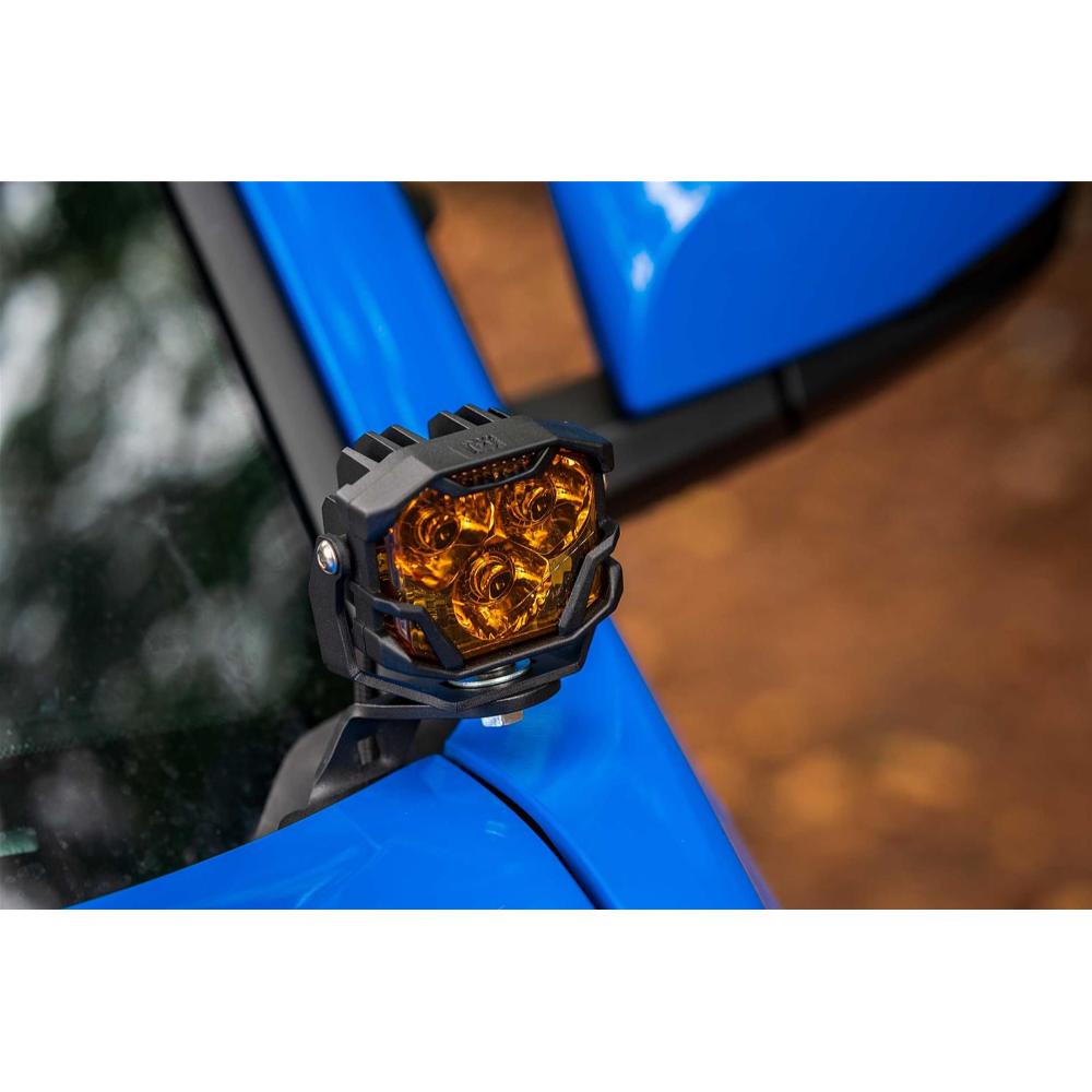 Morimoto 4Banger HXB LED Wide Beam Yellow Lights BAF012 mounted on blue off-road vehicle side mirror bracket with adjustable mount