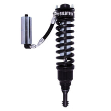Load image into Gallery viewer, The Bilstein B8 8112 2 inch 4Runner (03-09) Lift Kit w/ OME Springs is an off-road performance suspension system featuring a black shock with a spring attached to it.