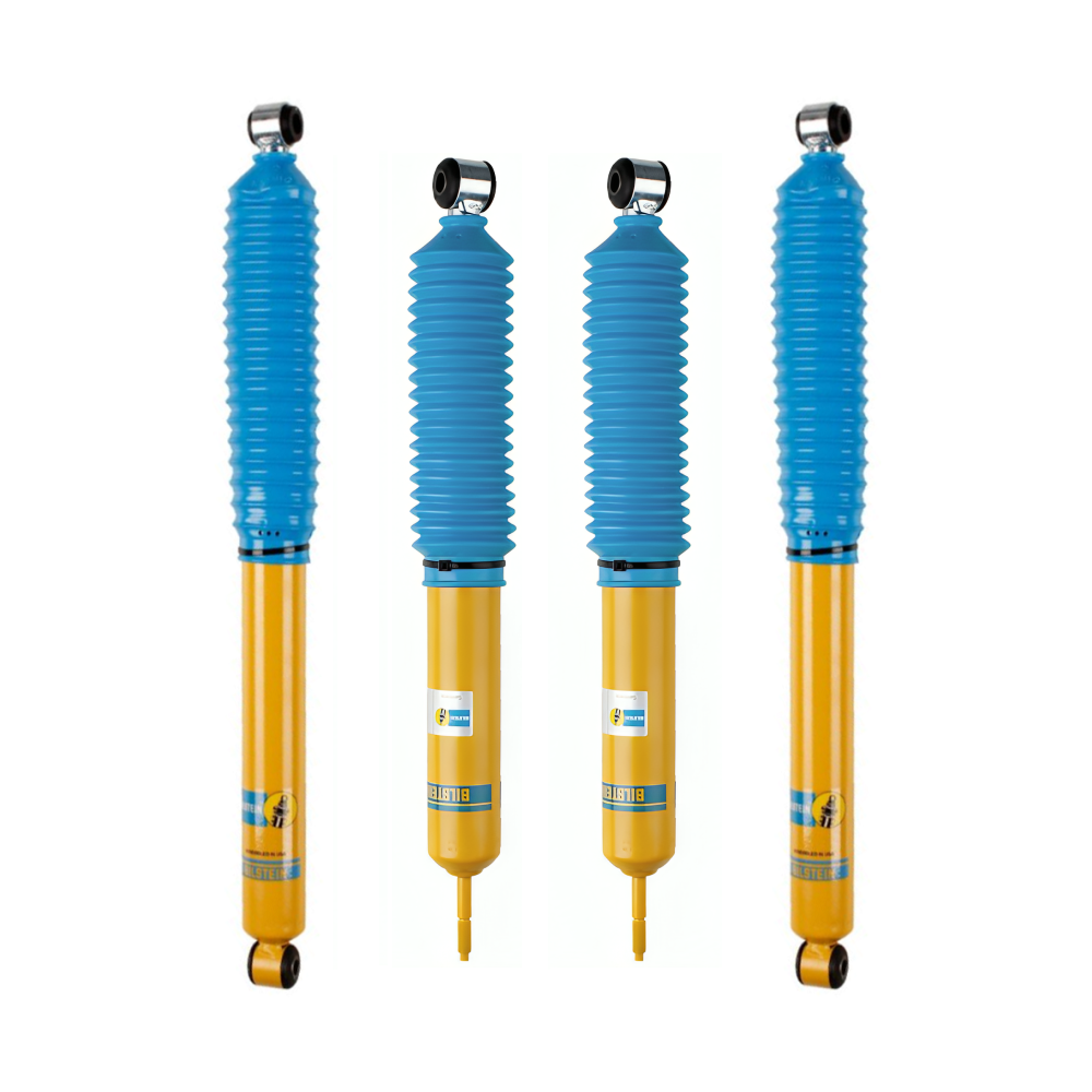 Four yellow and blue shock absorbers with protective bellows and mounting eyes