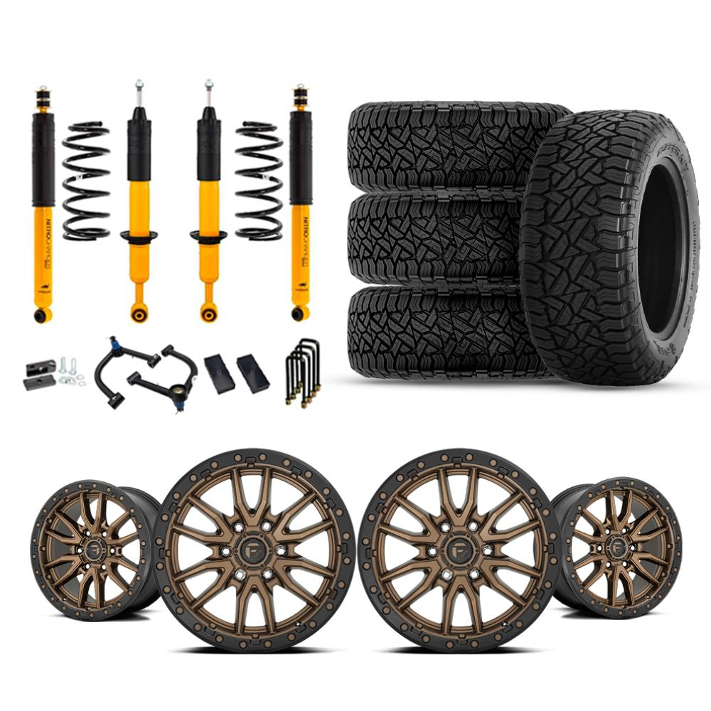 OME 2.5" Lift Kit + 17" Fuel Wheels & Tires Package for Tacoma (05-15) with heavy-duty suspension, bronze beadlock wheels, and all-terrain tires