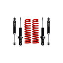Four black shock absorbers and two red coil springs for vehicle suspension