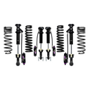 Off-road suspension kit with coil springs and shock absorbers arranged on a white background