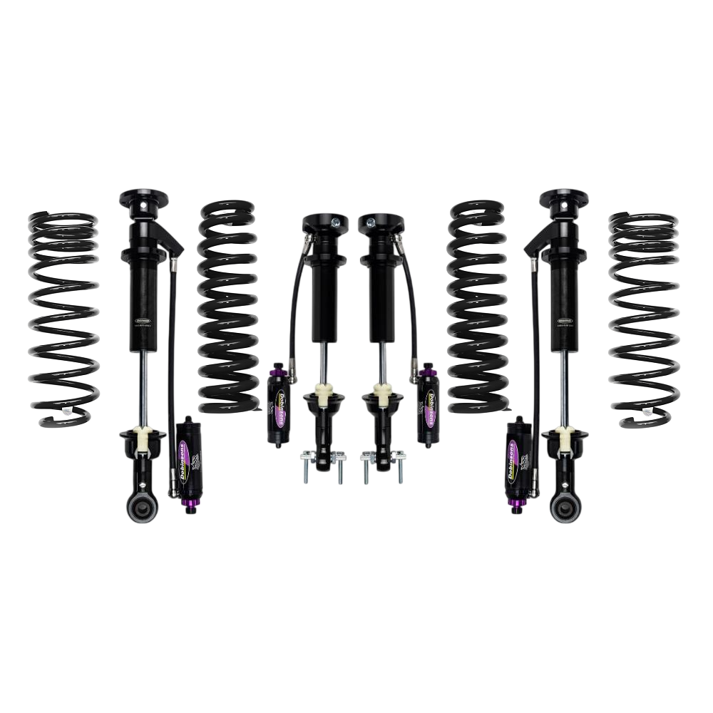 Off-road suspension kit with coil springs and shock absorbers arranged on a white background