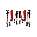 Off-road suspension components with red coil springs, black shock absorbers, and adjustable dampers
