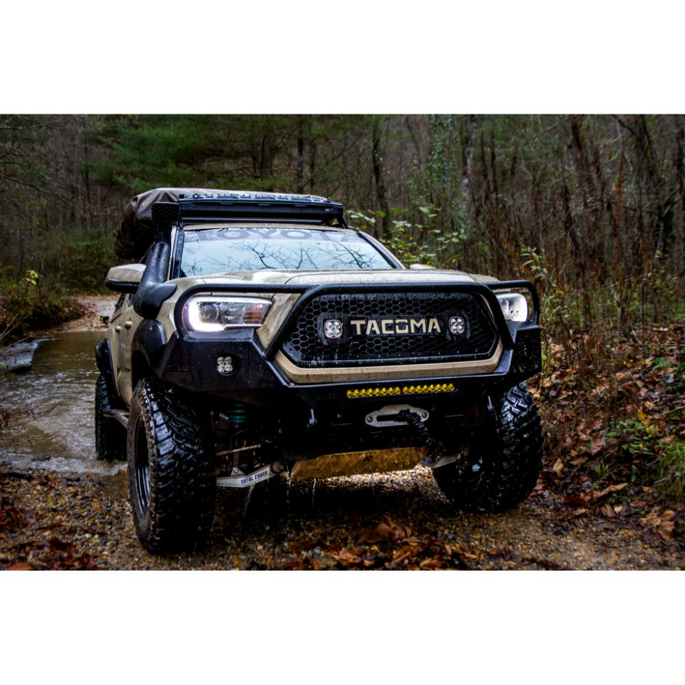 Dobinsons Twin Tube 2-3.5 inch Lift Kit for Tacoma (05-23) - Yellow/Black with assembled heavy-duty front shocks on off-road 2023 Toyota Tacoma