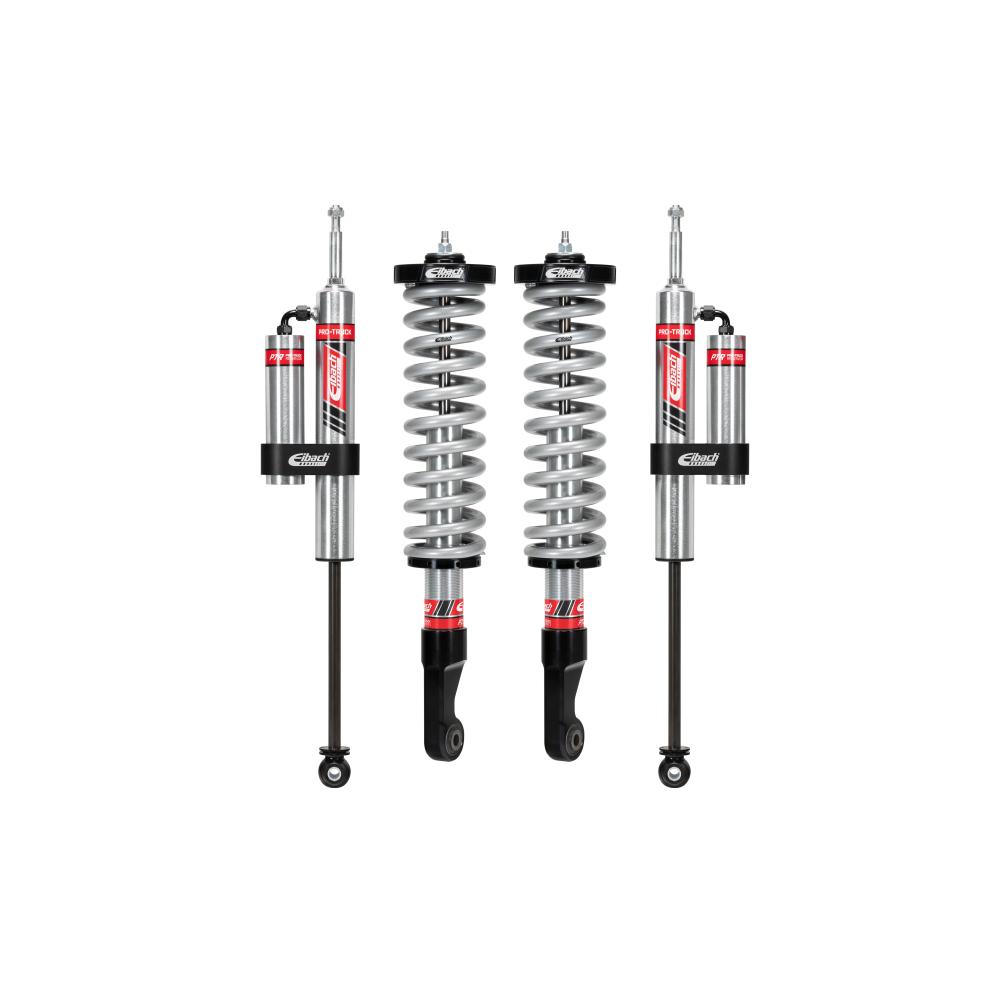 Camburg dual reservoir coilover shocks with heavy-duty springs, adjustable suspension components for off-road use.
