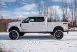 BDS 7 Inch Lift Kit w/ Radius Arm | Ford F250/F350 Super Duty (20-22) 4WD | Diesel with lifted suspension and off-road tires in snowy terrain